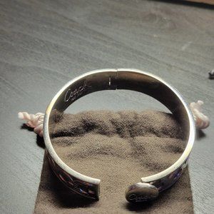 Coach silver hinged braclet.